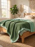 Creative Home's Green waffle and muslin organic cotton blanket layered on wooden bench, breathable 8-layer reversible luxury throw blanket,BB-DesH-WaMusBlnkt-Grn-6070,BB-DesH-WaMusBlnkt-Grn-Tw,BB-DesH-WaMusBlnkt-Grn-Q,BB-DesH-WaMusBlnkt-Grn-K,BB-DesH-WaMusBlnkt-Grn-100118,BB-DesH-WaMusBlnkt-Grn-100125