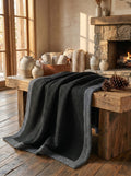 Creative Home's Black waffle weave organic cotton blanket with soft muslin backing styled on rustic wooden bench near fireplace, luxury reversible throw,BB-DesH-WaMusBlnkt-Bla-6070,BB-DesH-WaMusBlnkt-Bla-Tw,BB-DesH-WaMusBlnkt-Bla-Q,BB-DesH-WaMusBlnkt-Bla-K,BB-DesH-WaMusBlnkt-Bla-100118,BB-DesH-WaMusBlnkt-Bla-100125