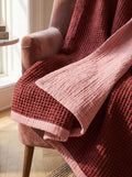 Creative Home's Burgundy waffle and Rose muslin organic cotton blanket draped over armchair, reversible 8-layer textured luxury throw,BB-DesH-WaMusBlnkt-Bgndy-6070,BB-DesH-WaMusBlnkt-Bgndy-Tw,BB-DesH-WaMusBlnkt-Bgndy-Q,BB-DesH-WaMusBlnkt-Bgndy-K,BB-DesH-WaMusBlnkt-Bgndy-100118,BB-DesH-WaMusBlnkt-Bgndy-100125