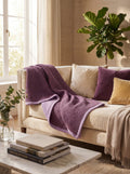 Creative Home's Purple waffle and Damson muslin organic cotton blanket styled on sofa, soft breathable 8-layer reversible throw blanket, breathable reversible luxury bedspread, reversible 8-layer textured luxury throw,BB-DesH-WaMusBlnkt-Dmsn-6070,BB-DesH-WaMusBlnkt-Dmsn-Tw,BB-DesH-WaMusBlnkt-Dmsn-Q,BB-DesH-WaMusBlnkt-Dmsn-K,BB-DesH-WaMusBlnkt-Dmsn-100118,BB-DesH-WaMusBlnkt-Dmsn-100125